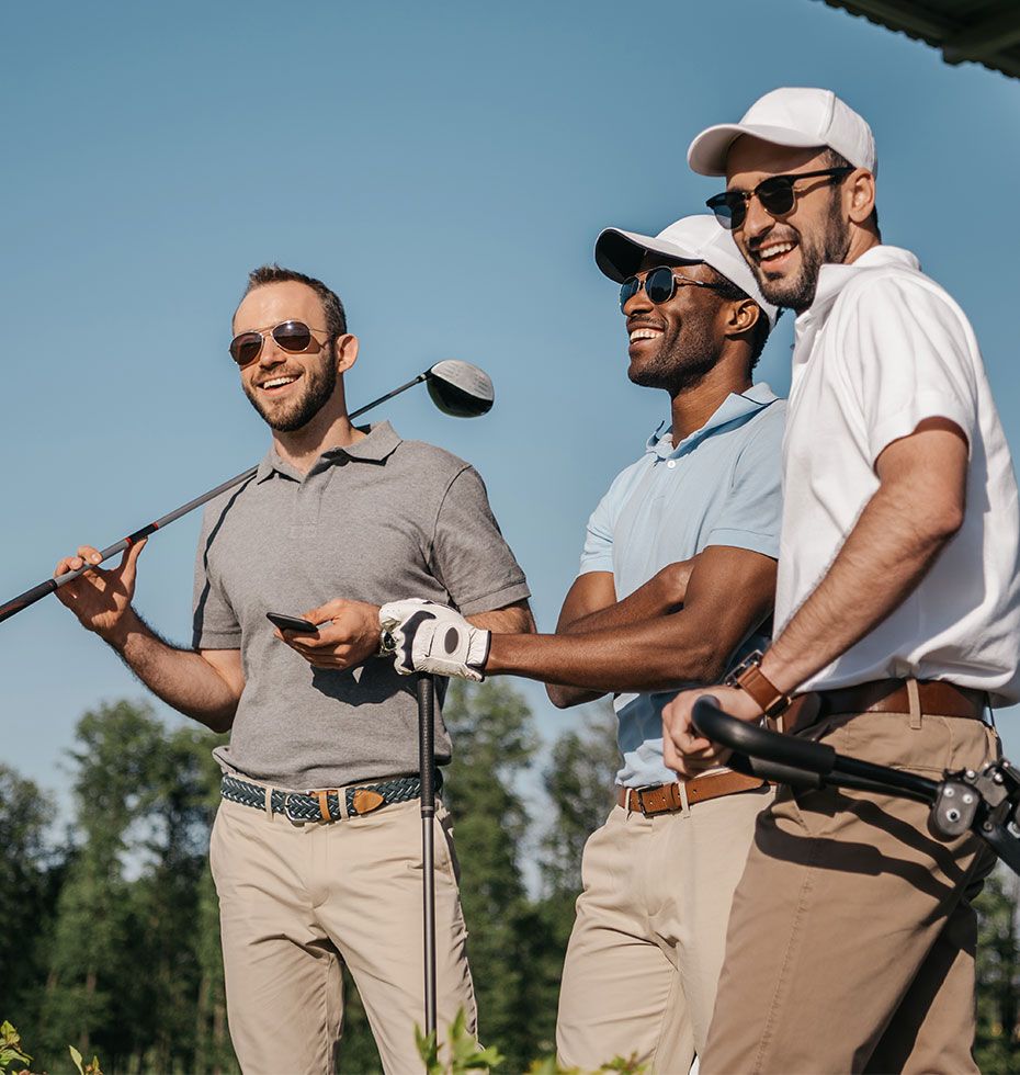 Three men golfing